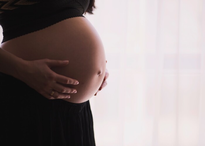 woman holding stomach